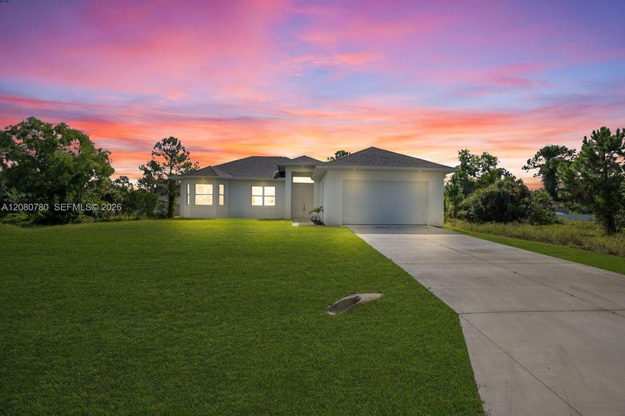 Front exterior of a new home in , Lehigh Acres, FL, highlighting curb appeal (Image 18). Front exterior of a new home in , Lehigh Acres, FL, highlighting curb appeal (Image 18).
