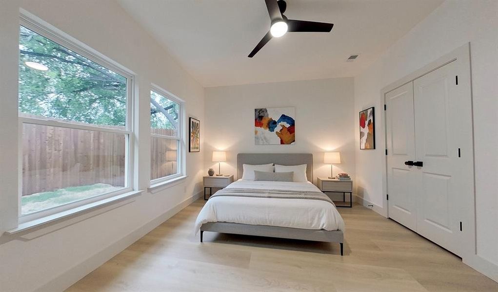 Light wood-finish flooring complements the neutral wall tones