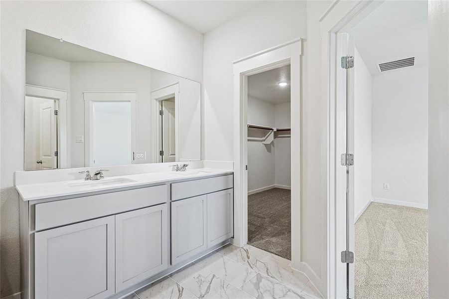 Bathroom featuring vanity and tile patterned flooring