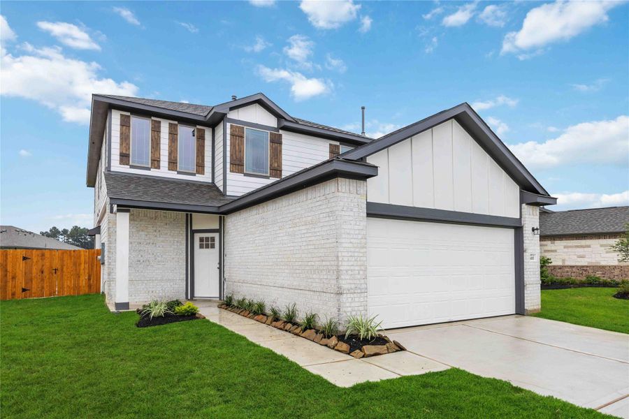 Front exterior of a new home in Granger Pines, Conroe, TX, highlighting curb appeal (Image 14). Front exterior of a new home in Granger Pines, Conroe, TX, highlighting curb appeal (Image 14).