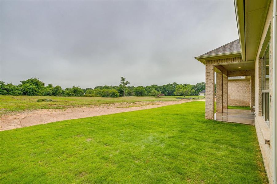 Exterior details and patio area of a home in , Burleson (Image 24).