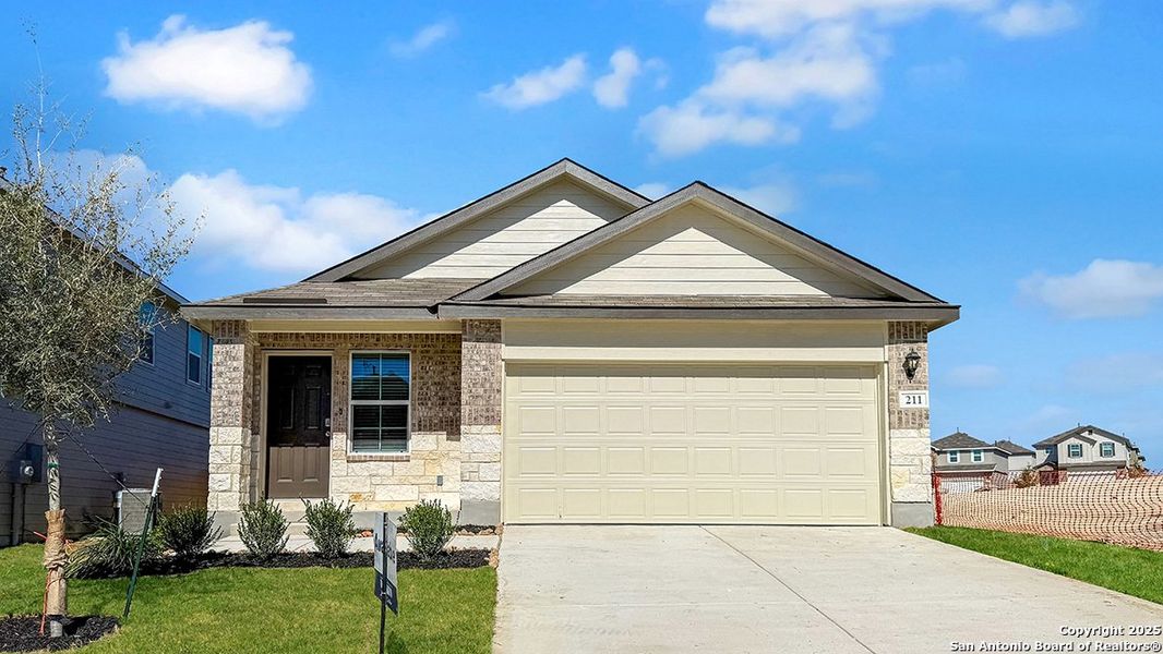 Front exterior of a new home in Redbird Ranch, San Antonio, TX, highlighting curb appeal (Image 2).