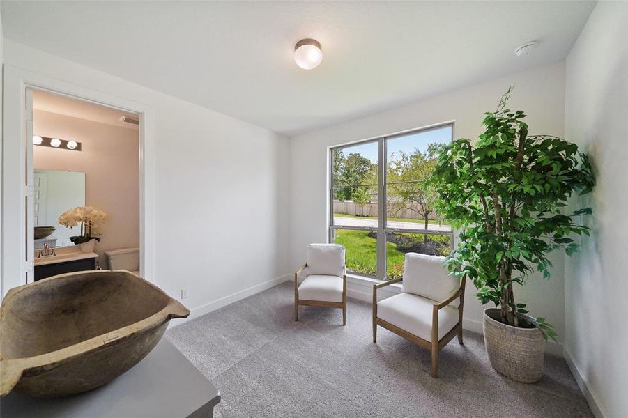 Second bedroom downstairs at front of home for privacy, with ensuite full bath.