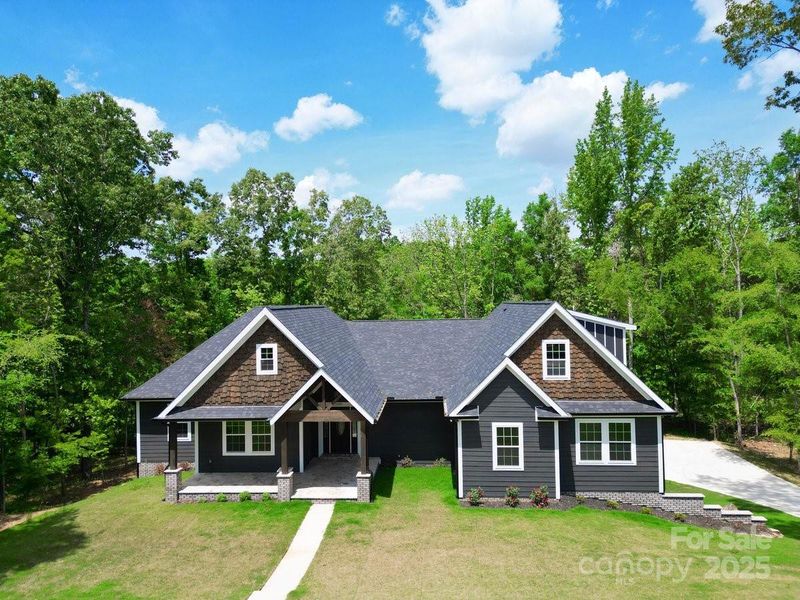 Front exterior of a new home in , Concord, NC, highlighting curb appeal (Image 18).