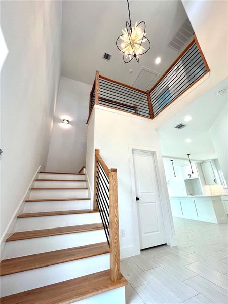 Sleek, modern handrail adds a stylish touch to this contemporary staircase.