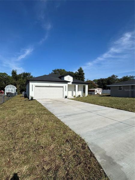 Front exterior of a new home in , Lake Wales, FL, highlighting curb appeal (Image 20). Front exterior of a new home in , Lake Wales, FL, highlighting curb appeal (Image 20).