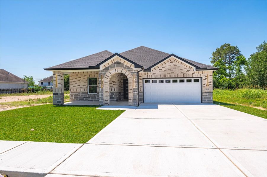 Front exterior of a new home in , Houston, TX, highlighting curb appeal (Image 21).