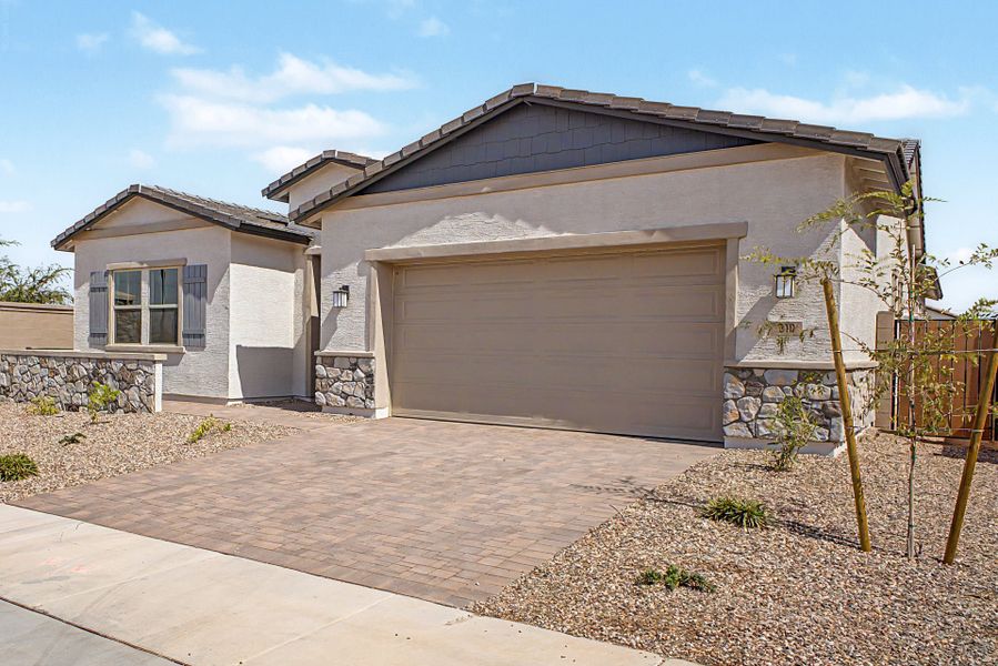 Front exterior of a new home in North Creek, Queen Creek, AZ, highlighting curb appeal (Image 2). Front exterior of a new home in North Creek, Queen Creek, AZ, highlighting curb appeal (Image 2).