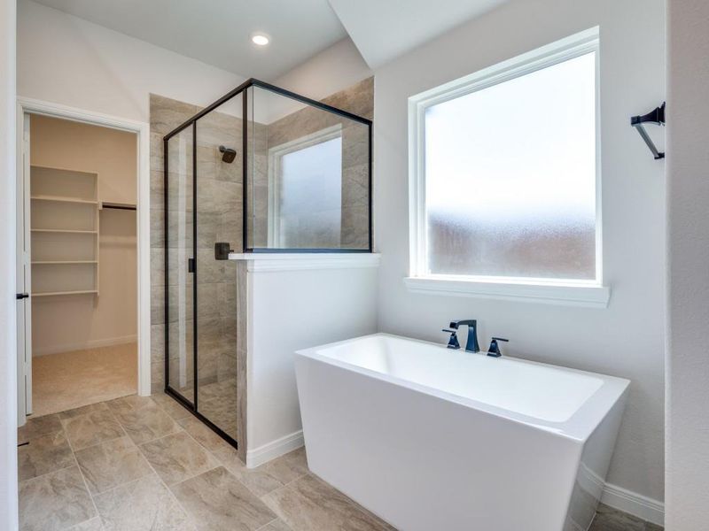 Ample closet space, a spacious walk in shower, freestanding tub....this dream owner's bath has it all!