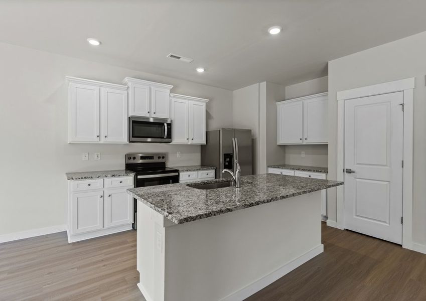 The kitchen has granite countertops