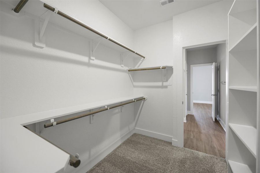 Oversized walk-in closet provides excellent storage and organization.