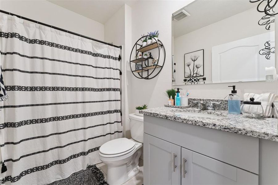 Furnished interior view inside a new home in Kindred, Kissimmee (Image 18).