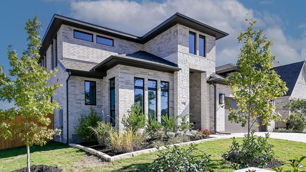 Front exterior of a new home in 6 Creeks 60', Kyle, TX, highlighting curb appeal (Image 15). Front exterior of a new home in 6 Creeks 60', Kyle, TX, highlighting curb appeal (Image 15).