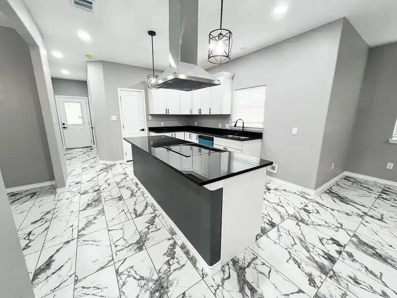 Looking toward Kitchen and Side Exit from Living Room Looking toward Kitchen and Side Exit from Living Room