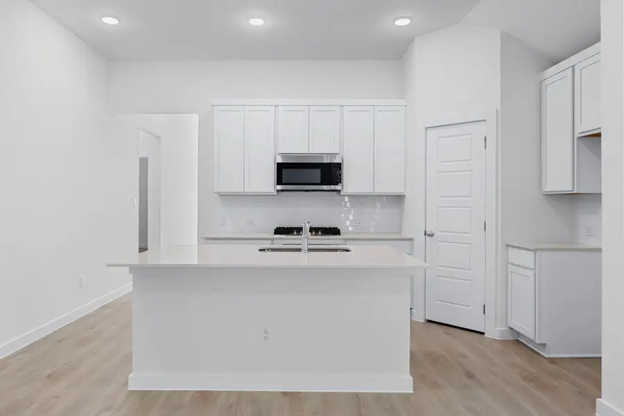 Kitchen in the Cypress home plan by Trophy Signature Homes - REPRESENTATIVE PHOTO Kitchen in the Cypress home plan by Trophy Signature Homes - REPRESENTATIVE PHOTO