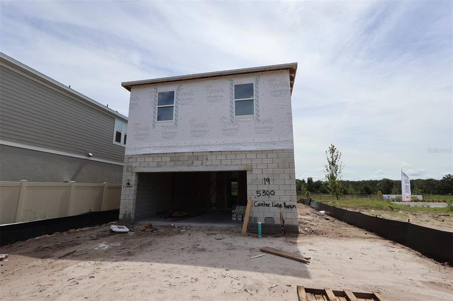 In-progress construction of a new home in Center Lake on the Park, St. Cloud, FL (Image 20).