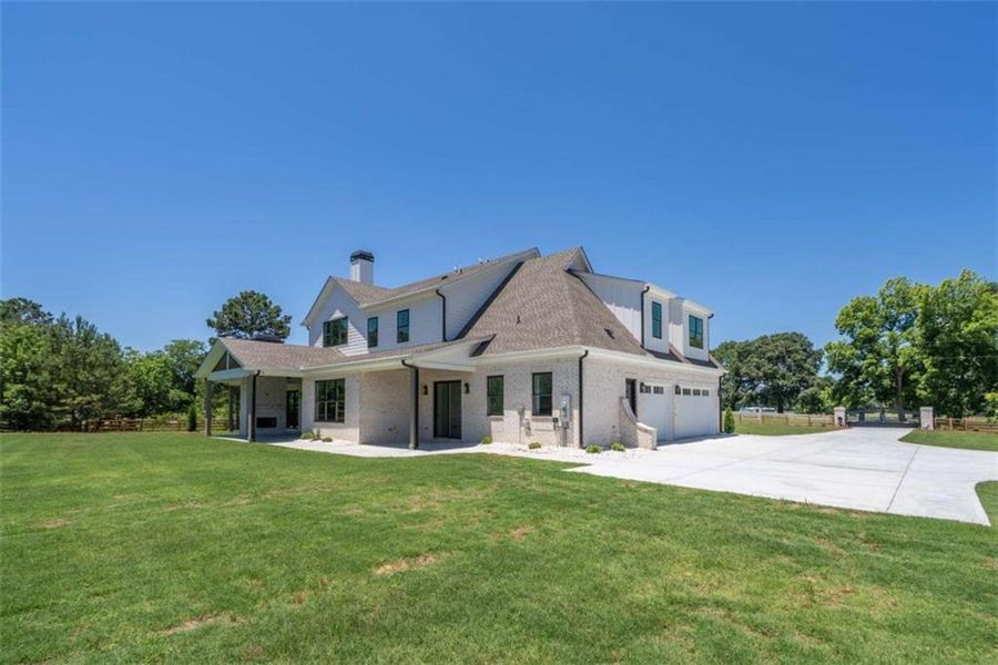 Front exterior of a new home in , Monroe, GA, highlighting curb appeal (Image 32).