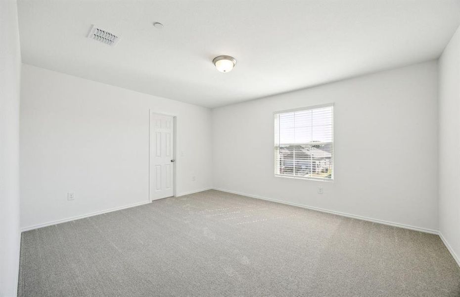 Spacious secondary bedroom with large windows Spacious secondary bedroom with large windows