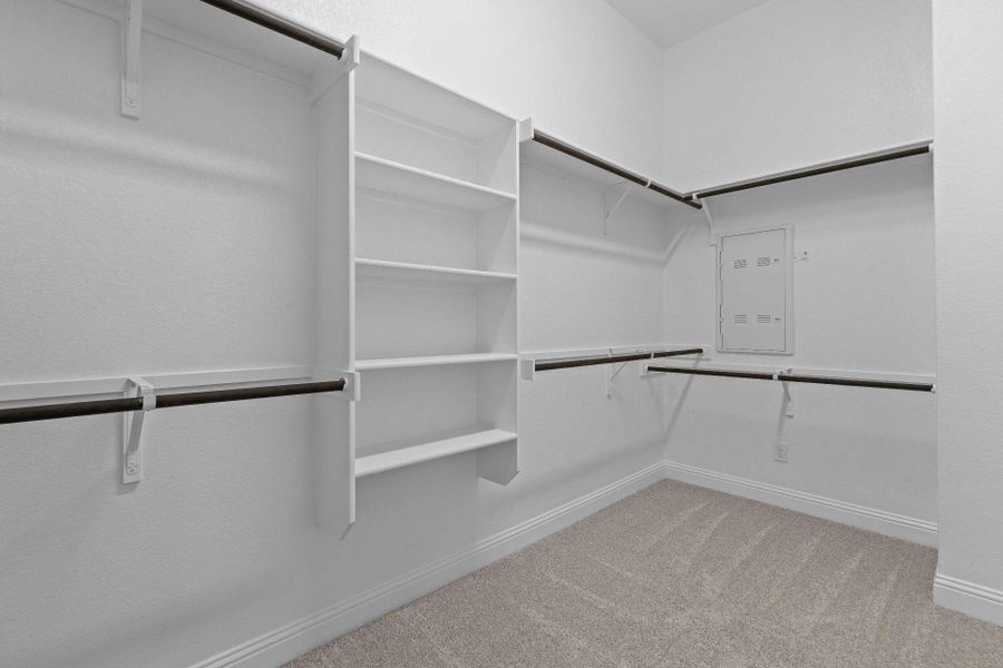Walk-in closet in Primary Bedroom Walk-in closet in Primary Bedroom