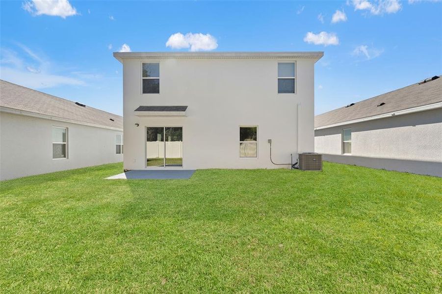 Exterior details and patio area of a home in Harvest Ridge, Zephyrhills (Image 30).