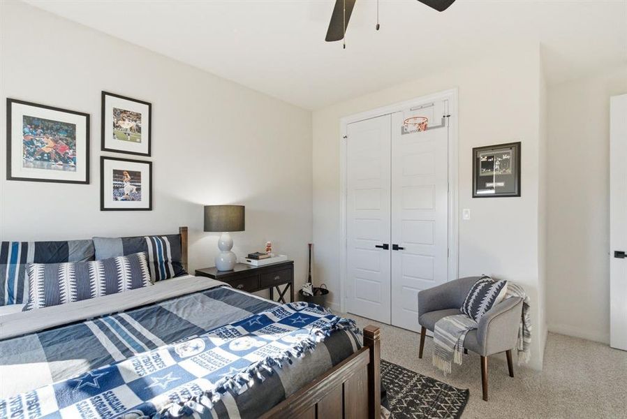 Bedroom featuring carpet, a closet, and ceiling fan
