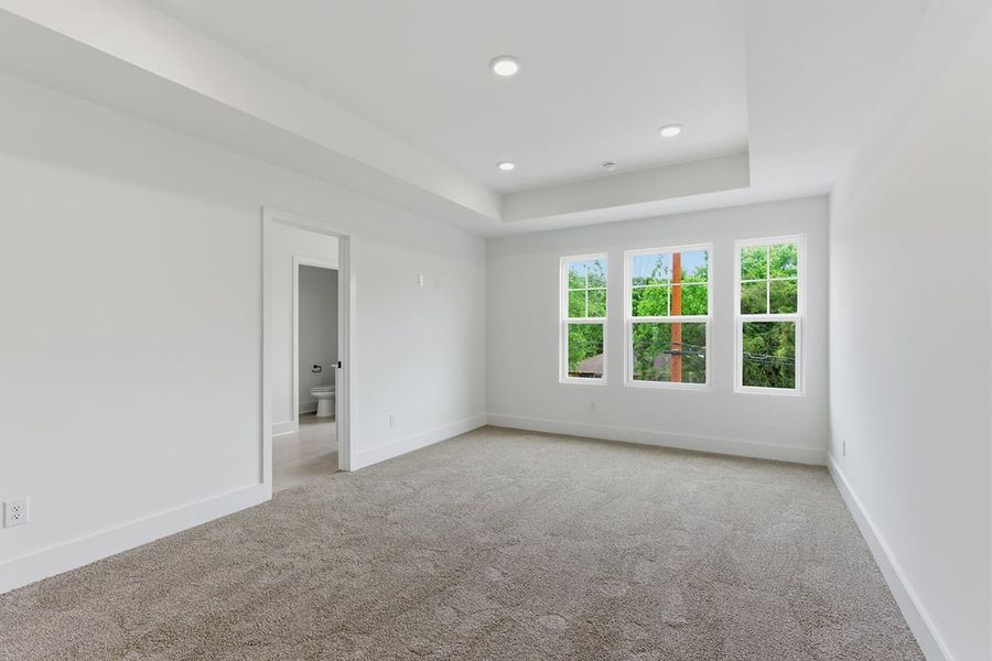 A room with windows and a door.