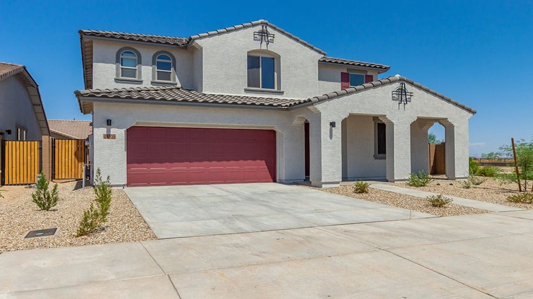 Front exterior of a home in the Los Cielos at Rancho Mercado community, located in Surprise, AZ (Image 19).