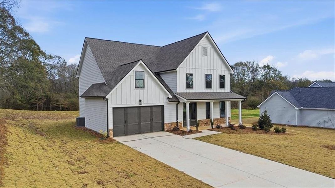 Front exterior of a new home in , Statham, GA, highlighting curb appeal (Image 32).