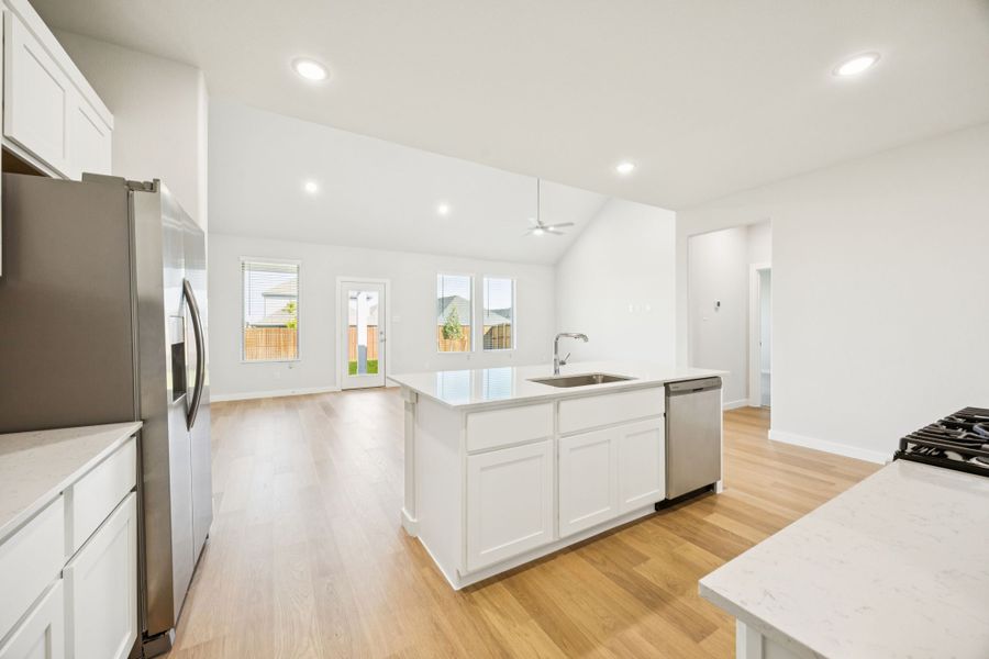 Kitchen in the Masters home plan by Trophy Signature Homes – REPRESENTATIVE PHOTO