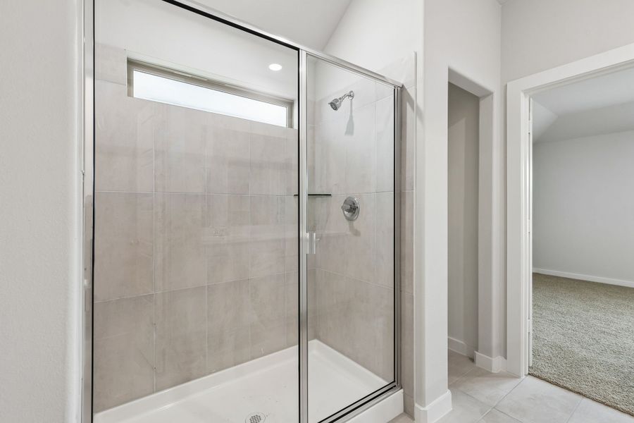 Primary Bathroom in the Oscar home plan by Trophy Signature Homes – REPRESENTATIVE PHOTO