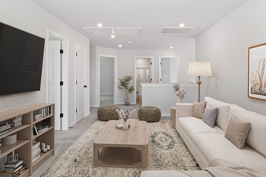 A living room with a large mirror. A living room with a large mirror.