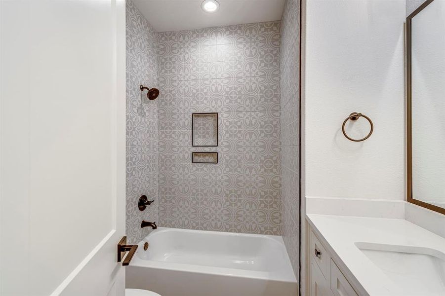 Bathroom with toilet, shower / tub combination, and vanity Bathroom with toilet, shower / tub combination, and vanity