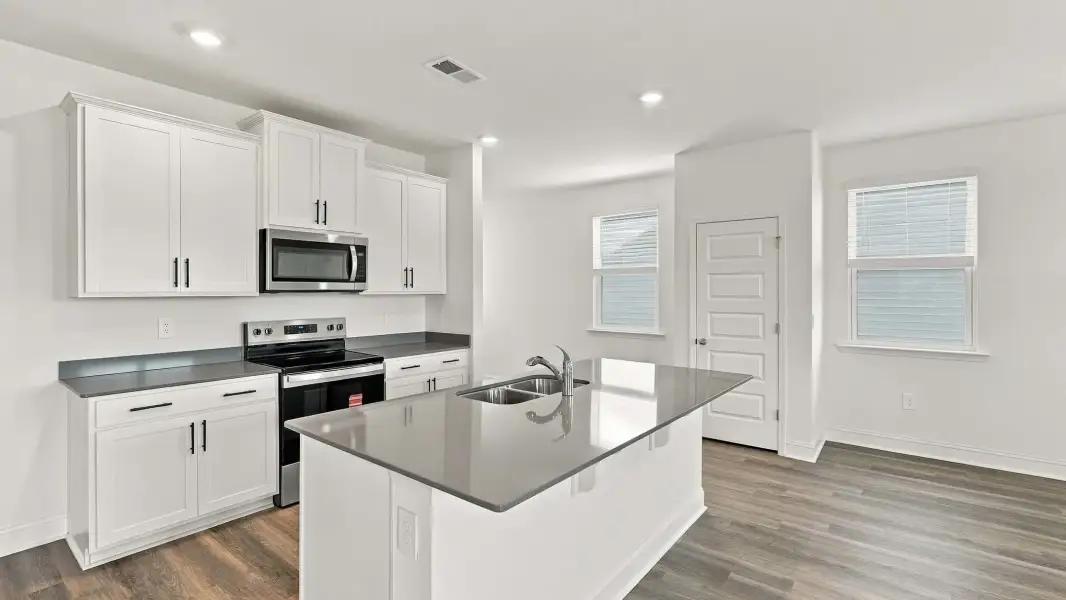 Furnished interior view inside a new home in The Lakes at North Glynn, Brunswick (Image 5).
