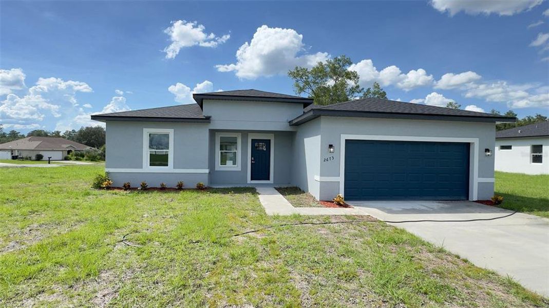 Front exterior of a new home in , Ocala, FL, highlighting curb appeal (Image 16). Front exterior of a new home in , Ocala, FL, highlighting curb appeal (Image 16).