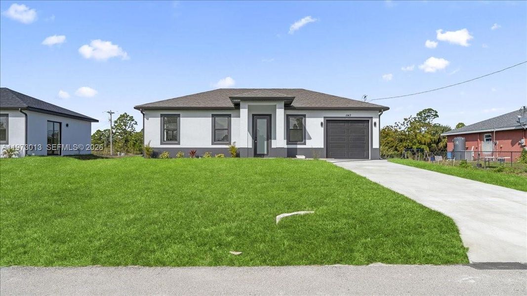 Front exterior of a new home in , Lehigh Acres, FL, highlighting curb appeal (Image 19).
