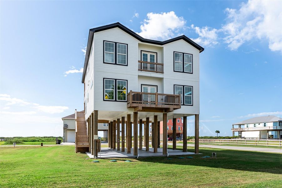 Front exterior of a new home in , Bolivar Peninsula, TX, highlighting curb appeal (Image 1).