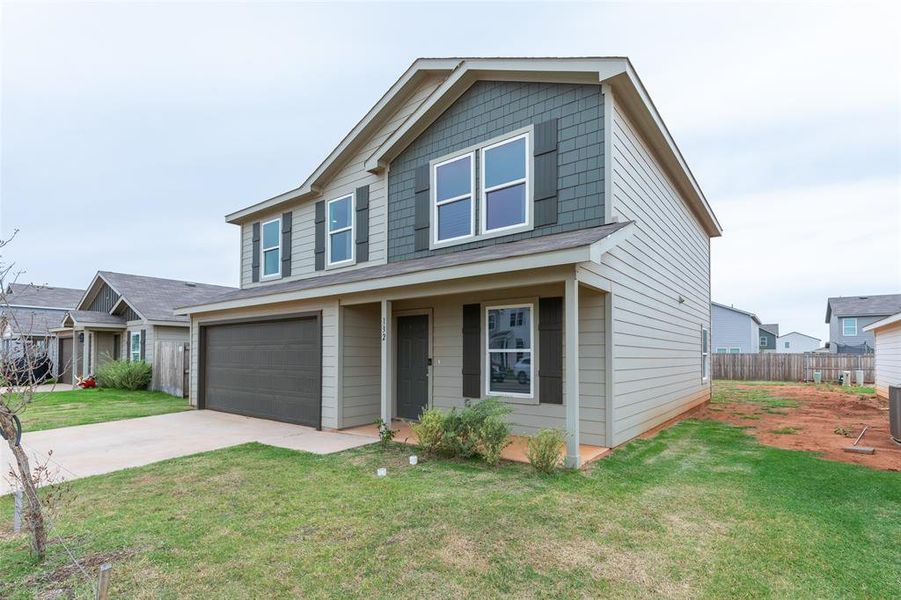Front exterior of a new home in Waterside at Cedar Creek, Abilene, TX, highlighting curb appeal (Image 22).