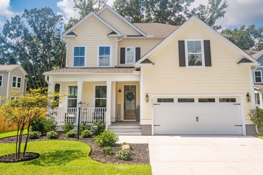 Front exterior of a new home in Overlook at Copahee Sound, Awendaw, SC, highlighting curb appeal (Image 31). Front exterior of a new home in Overlook at Copahee Sound, Awendaw, SC, highlighting curb appeal (Image 31).