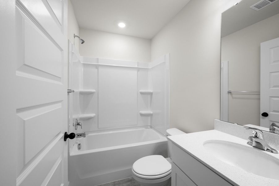 Photo is of a similar home