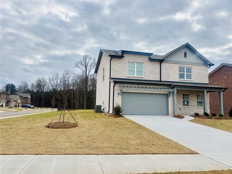 Front exterior of a new home in Kendall Grove, McDonough, GA, highlighting curb appeal (Image 10).