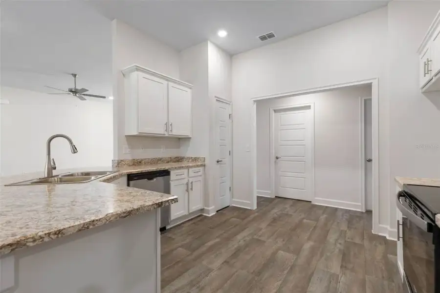 Representative furnished interior of a home built from the 2265 by Adams Homes in Flagler Estates, Hastings (Image 10).