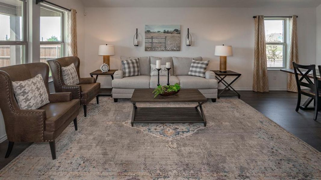 Living room with wood finished floors and baseboards