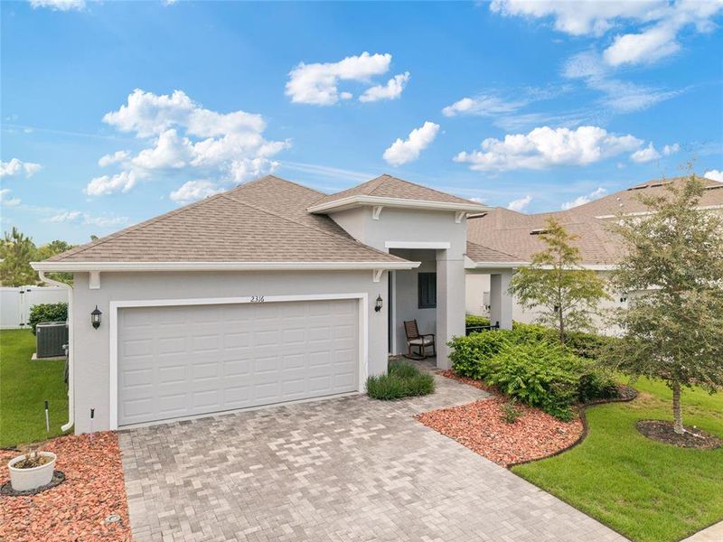 Front exterior of a new home in Summerbrooke, Mount Dora, FL, highlighting curb appeal (Image 2). Front exterior of a new home in Summerbrooke, Mount Dora, FL, highlighting curb appeal (Image 2).