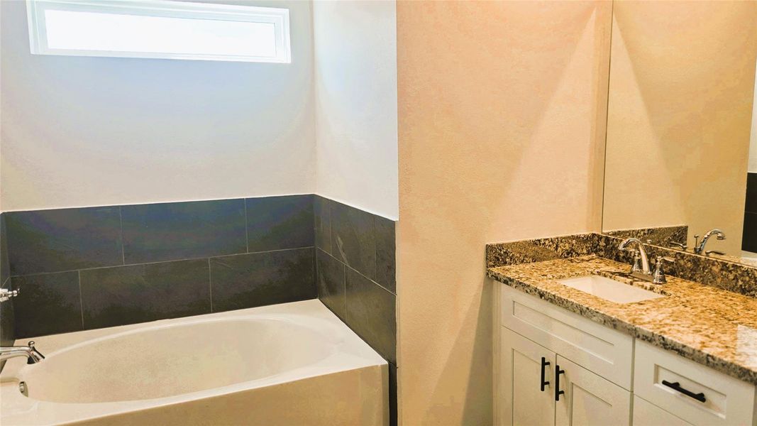 Ensuite bathroom featuring a relaxing soaking Tub with separate shower Ensuite bathroom featuring a relaxing soaking Tub with separate shower