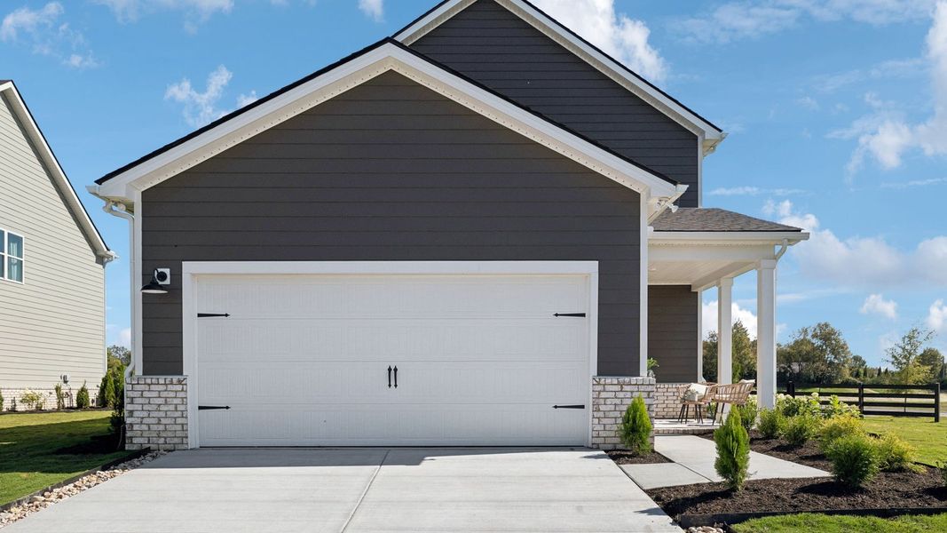 Front exterior of a new home in Harvest Point, Spring Hill, TN, highlighting curb appeal (Image 22).