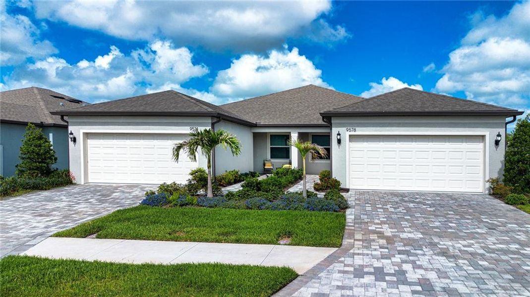 Front exterior of a new home in , Parrish, FL, highlighting curb appeal (Image 2). Front exterior of a new home in , Parrish, FL, highlighting curb appeal (Image 2).