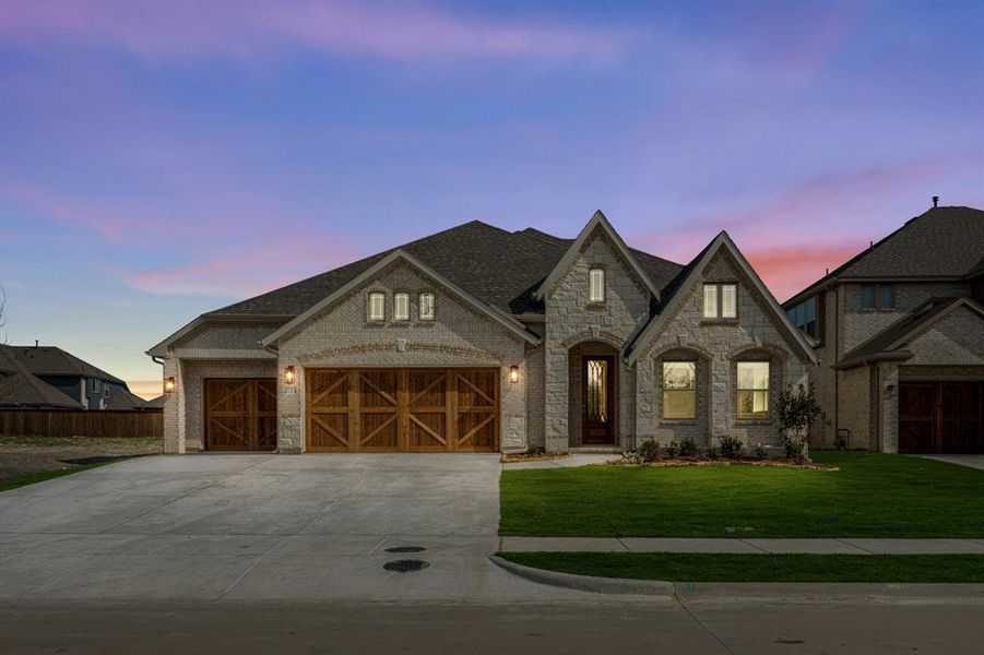 Front exterior of a new home in Terracina, Rockwall, TX, highlighting curb appeal (Image 2).