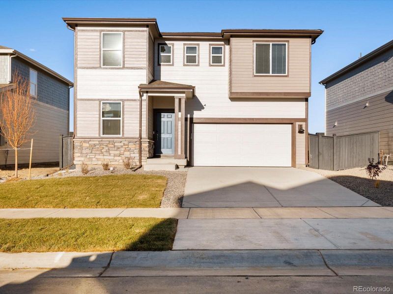 Front exterior of a new home in Westgate, Greeley, CO, highlighting curb appeal (Image 2).
