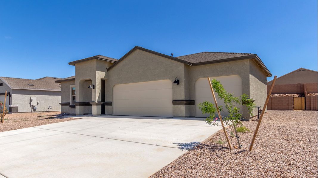 Representative exterior photo of a completed home built from the Cali - Plan H40I by D.R. Horton in Tortolita Trails, Marana, AZ (Image 2).