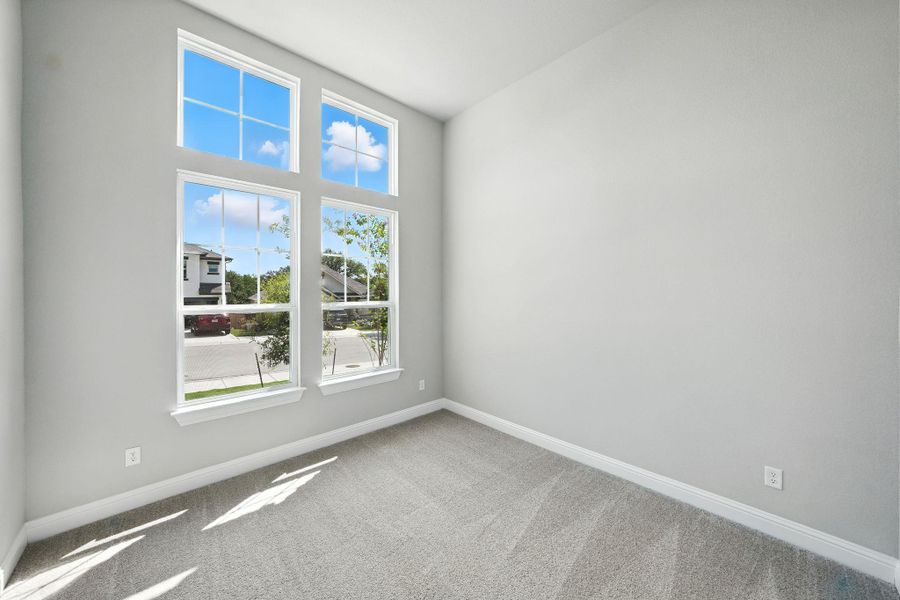 Carpeted empty room featuring baseboards Carpeted empty room featuring baseboards